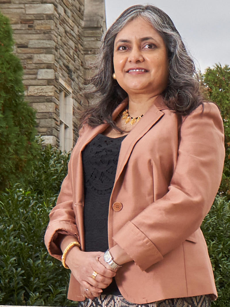 woman wearing a pink blazer