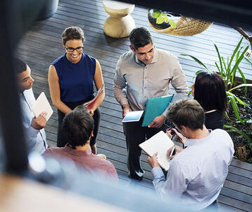 Group of participants chatting at the Food Industry Summit at Saint Joseph's University