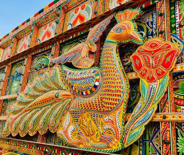 Truck in Pakistan featuring a peacock