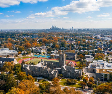 aerial shot of saint joseph's university's campus and the philadelphia skyline in the fall