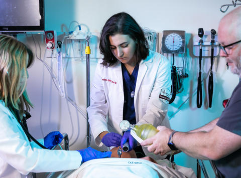 3 Physician assistant students giving oxygen in a simulation lab