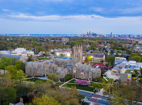 Aerial shot of Saint Joseph's University and the Philadephia skyline during sunset