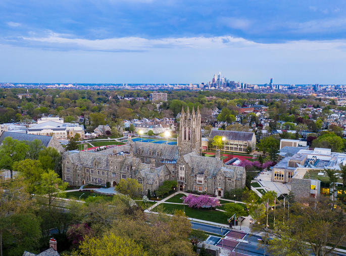 Aerial shot of Saint Joseph's University and the Philadephia skyline during sunset
