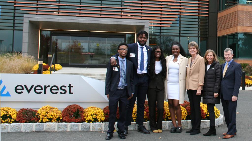 A group of Saint Joseph's students, faculty and staff outside of the Everest Insurance office