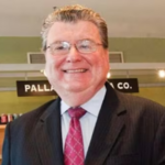 Dr. John Stanton smiling 