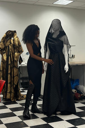 Philadelphia Fashion Incubator Designer-In-Residence, Jeanette Limas, with one of the dresses she designed