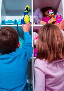 photograph of children in toy closet
