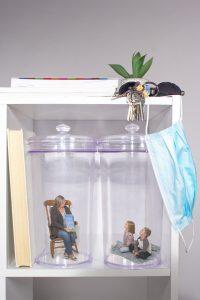 figurines in glass jars