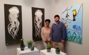 photograph of potted plants with artists