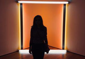 photo of woman's outline in doorway