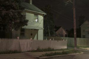 photograph of house with gate