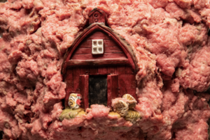 a tiny barn in the middle of ground beef