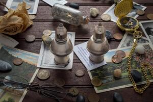 photograph of coin and postcards on table