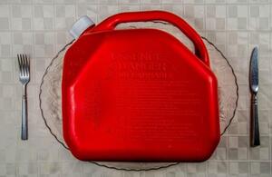 red gasoline jug served as a place setting