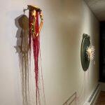 photograph of ribbon hanging off of wall