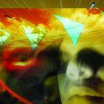 photograph of statue's mouth under colored transparency