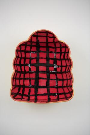 red and black checked porcelain object