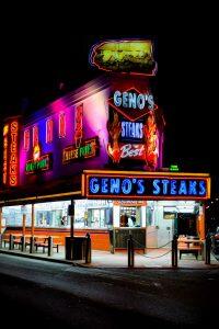 photograph of Geno's Cheesessteaks at night