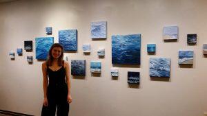 artist and paintings of water