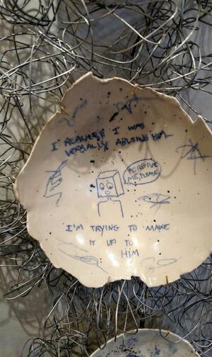 broken pottery with writing on the inside