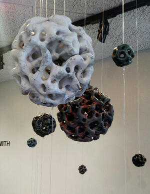 spherical sculptures hanging from the ceiling