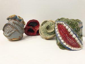 ceramic figures with open mouths