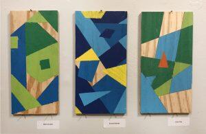 3 geometric abstracts hung on wall