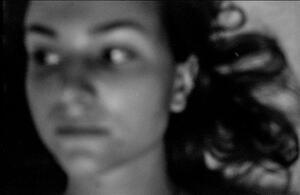 B+W portrait photograph of a girl with her hair blowing