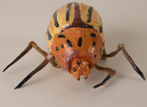 ceramic spider with stripes and spots