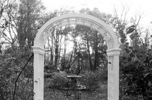 B+W photograph of garden trellis and fountain