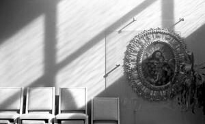 B+W photograph of light and shadows on row of chairs