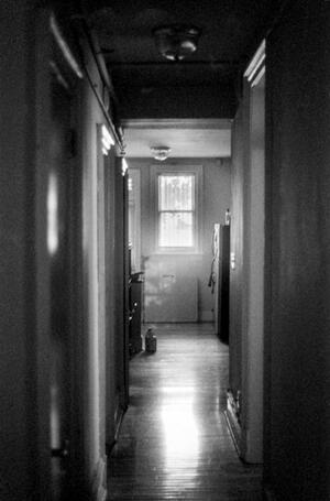 B+W photograph of dark hallwayy