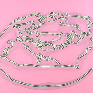 neon donut against pink background